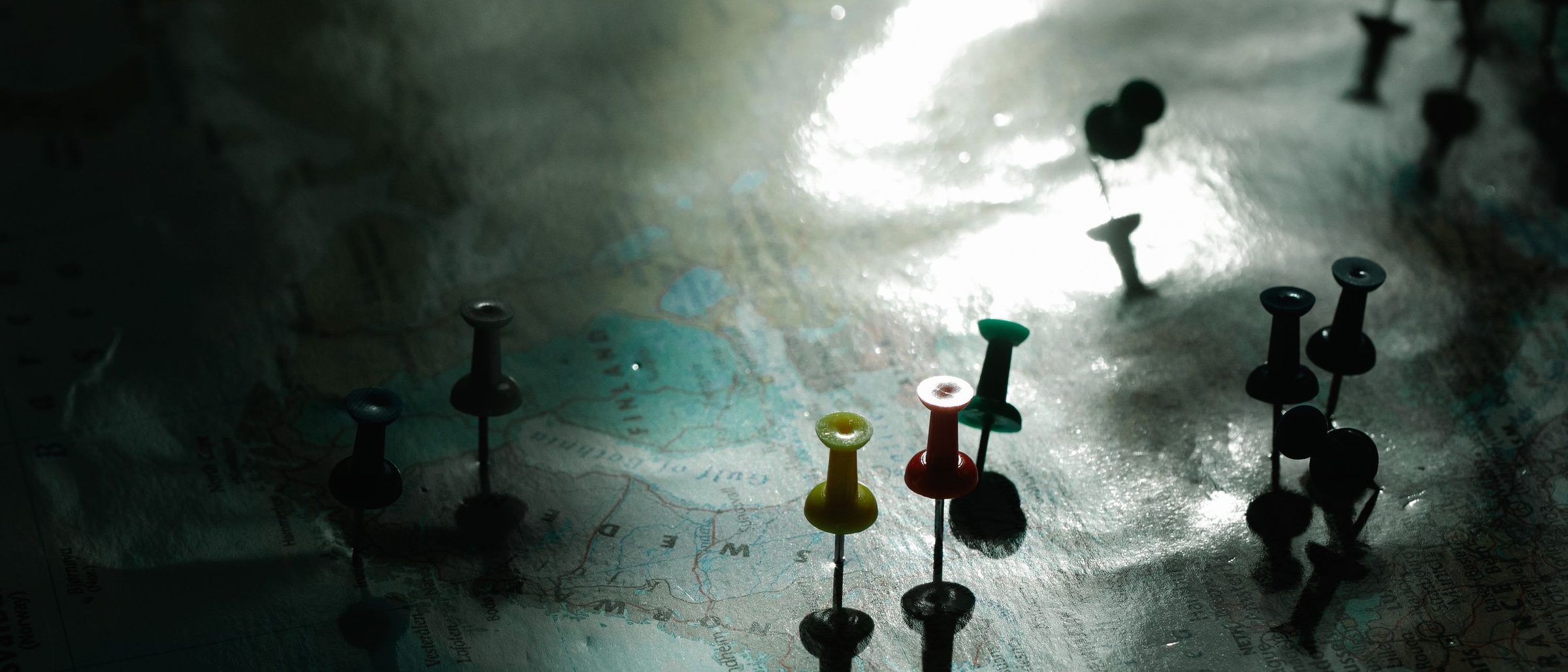 A pinned world map on an office wall.